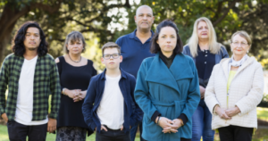 a group of people standing together in a park